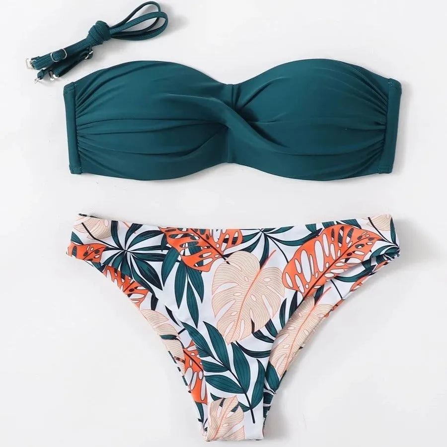 Split push up bikini swimsuit set in green on a mannequin, showing top and briefs style.