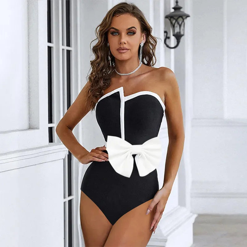 Women's black and white colour-block one-piece swimsuit with asymmetric bow and irregular tube top