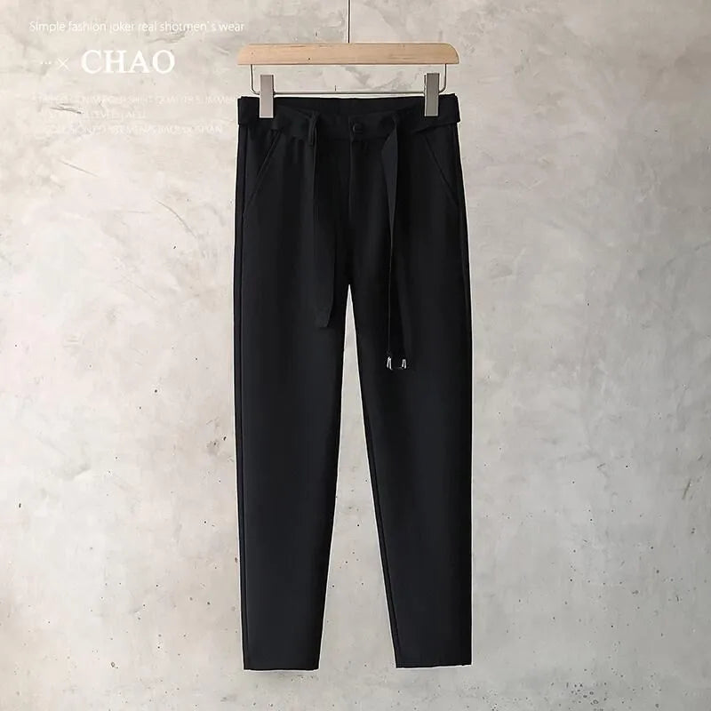Boys slim straight tapered wool trousers in grey, shown with a straight leg opening.