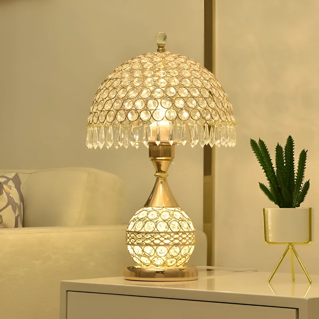 Gold crystal desk lamp with iron art base on wooden table