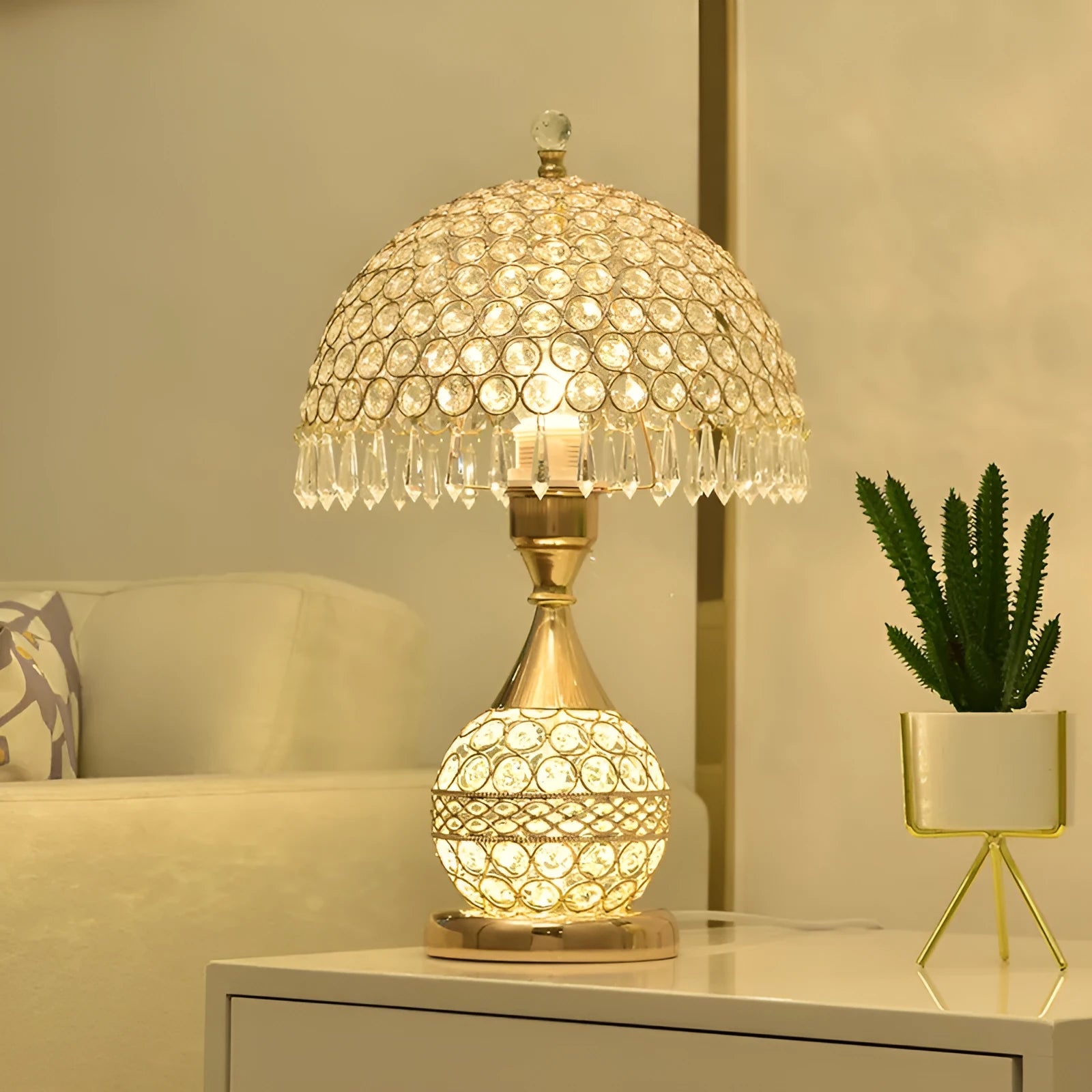 Gold crystal desk lamp with iron art base on wooden table