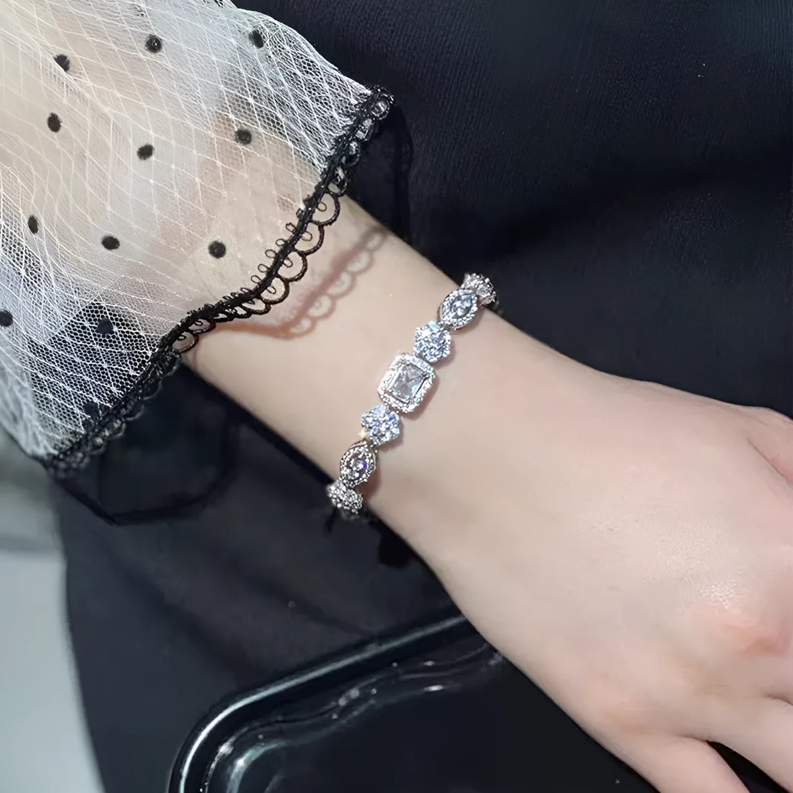 Women's silver-plated bracelet with sparkling zircon stones in a geometry shape.