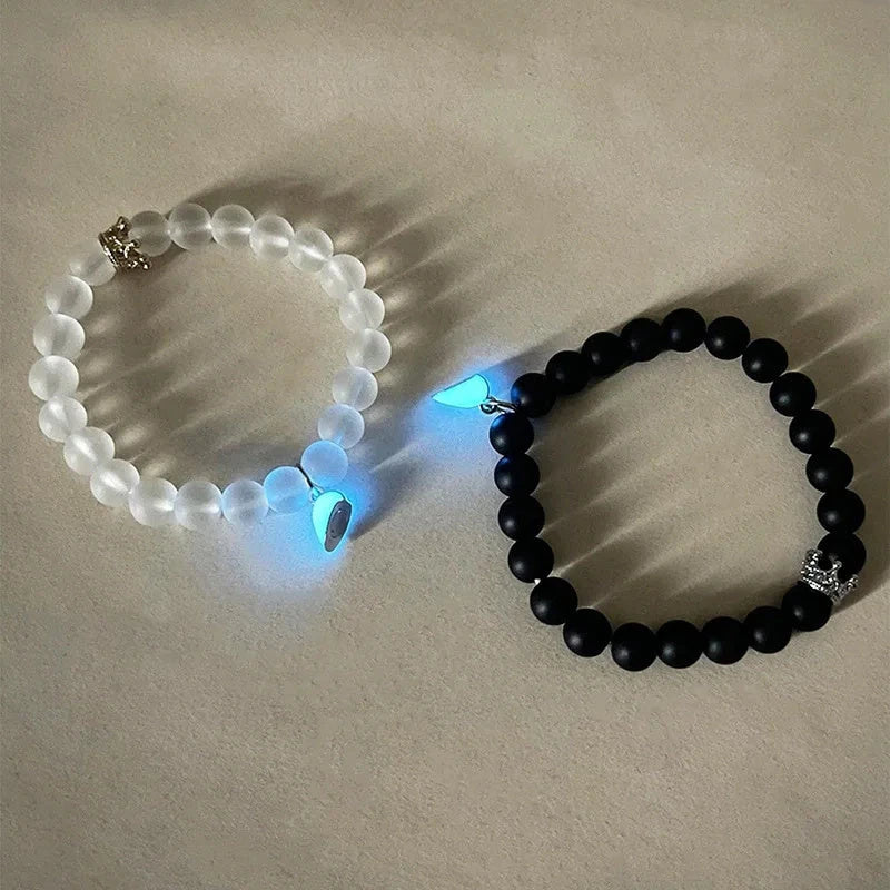 Luminous glow-in-the-dark crown bracelet set in white and black colors, showcasing a unique design and enchanting nighttime glow