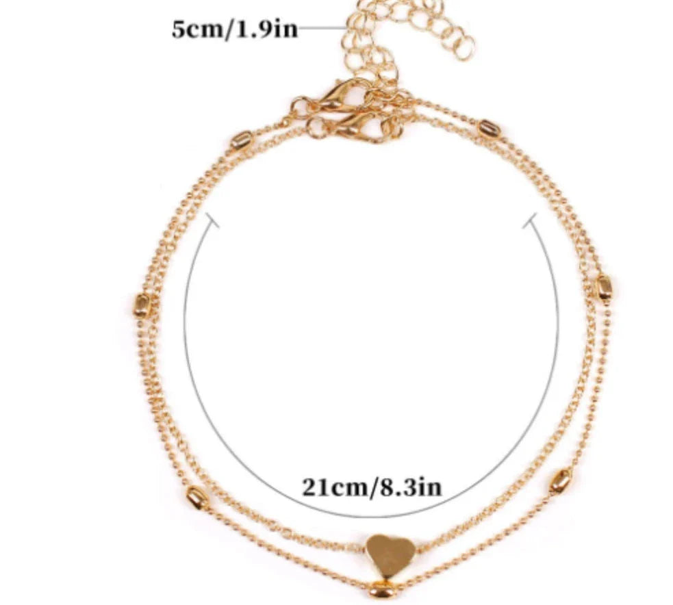 Double-layered anklet with retro beach ball chain and heart-shaped charm in gold and silver
