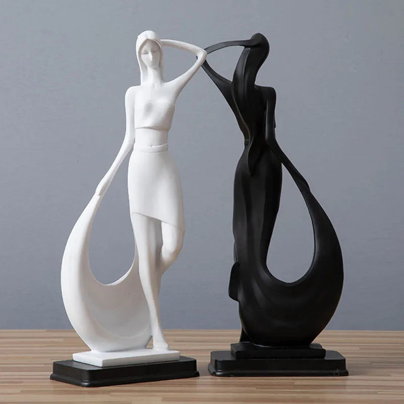Resin abstract smart dancer sculpture in sub-white finish on a shelf, modern home decoration