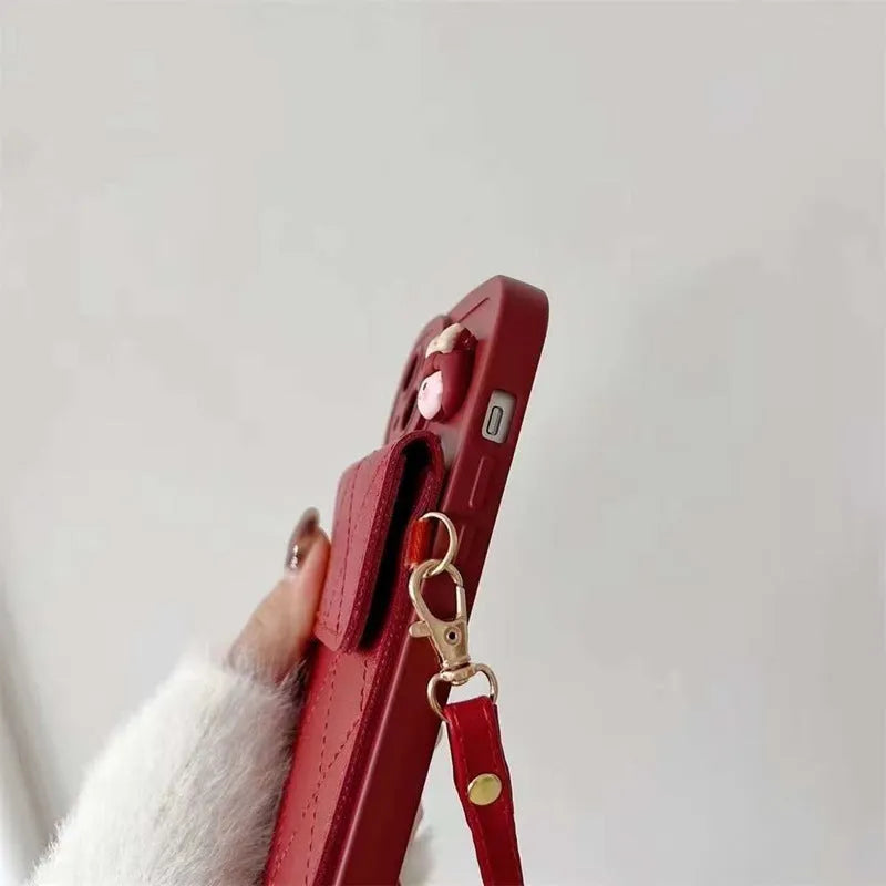 Red TPU crossbody card holder with lanyard for iPhone 15 showing diamond plaid pattern and rear card slot