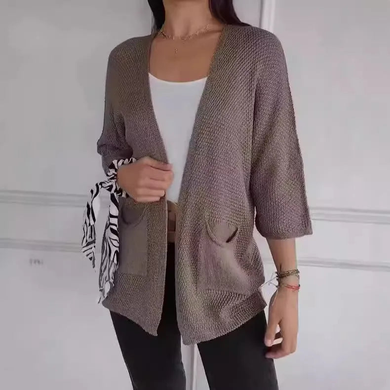 Women's waffle texture cardigan coat in army green with nine-quarter length sleeves and pockets.