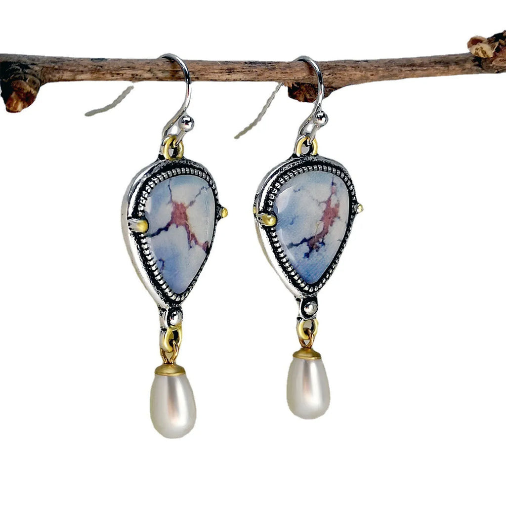 Retro blue women's drop earrings with synthetic opal, pearl, and geometric metalwork.