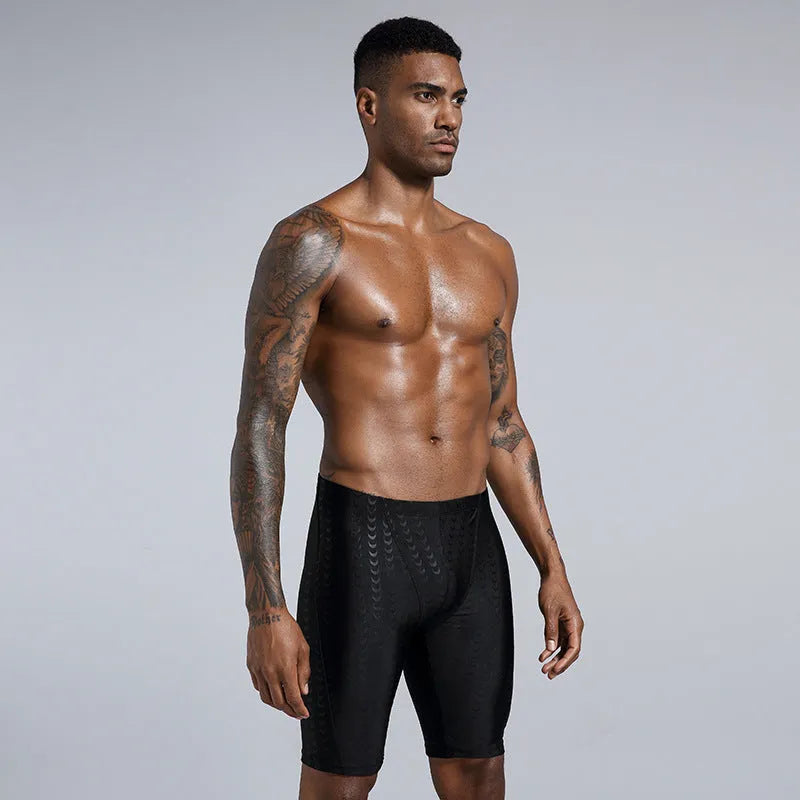 Men's solid colour polyester swimming trunks for surfing and beach use in sizes XL to 4XL