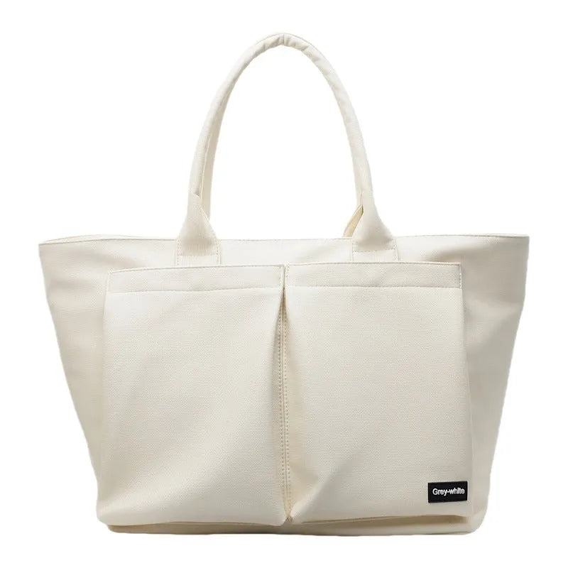 Lightweight sporty shoulder bag in PU material, shown in green colour