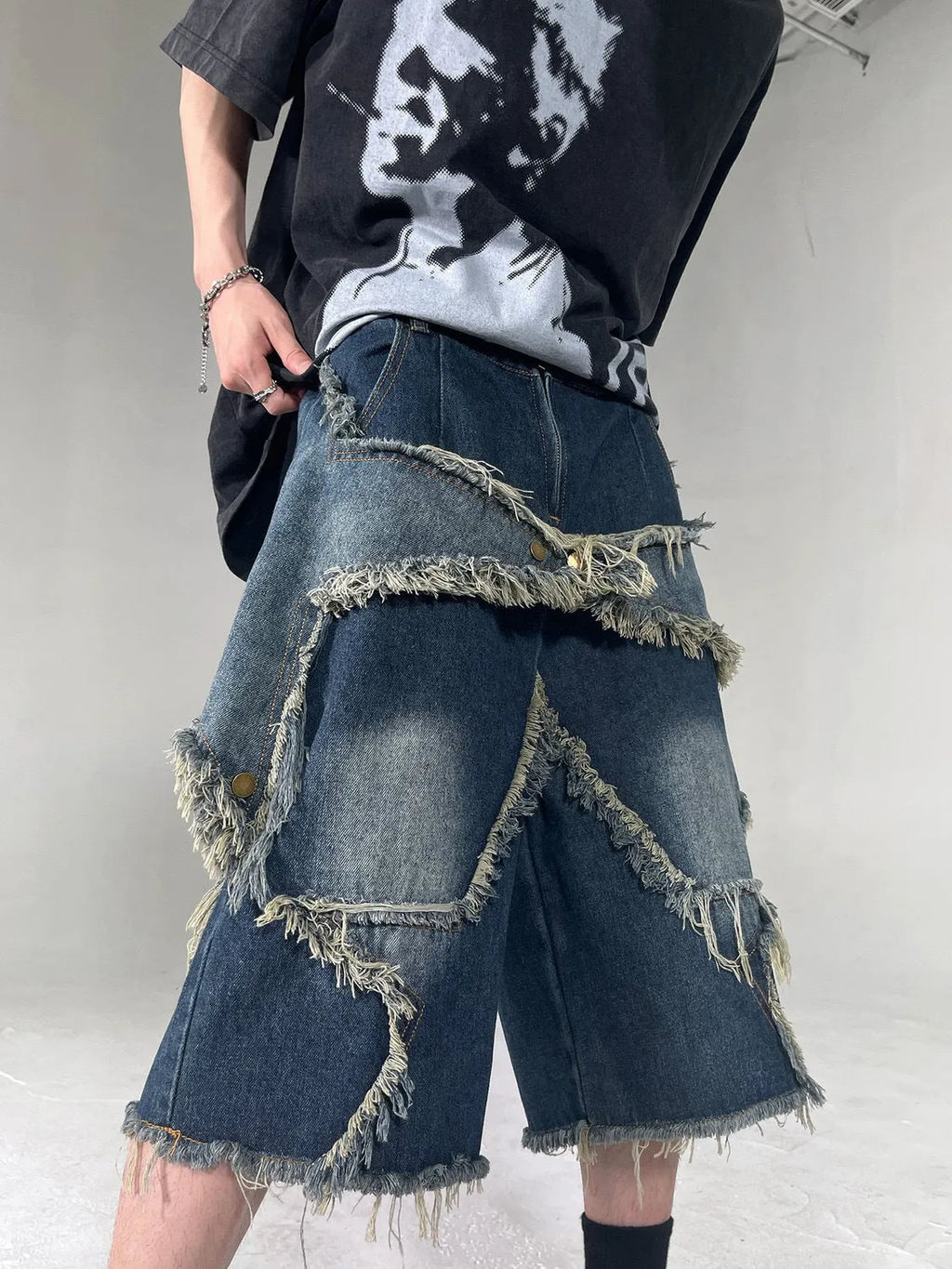 Men's blue retro denim shorts with frayed five-pointed star design and distressed detailing