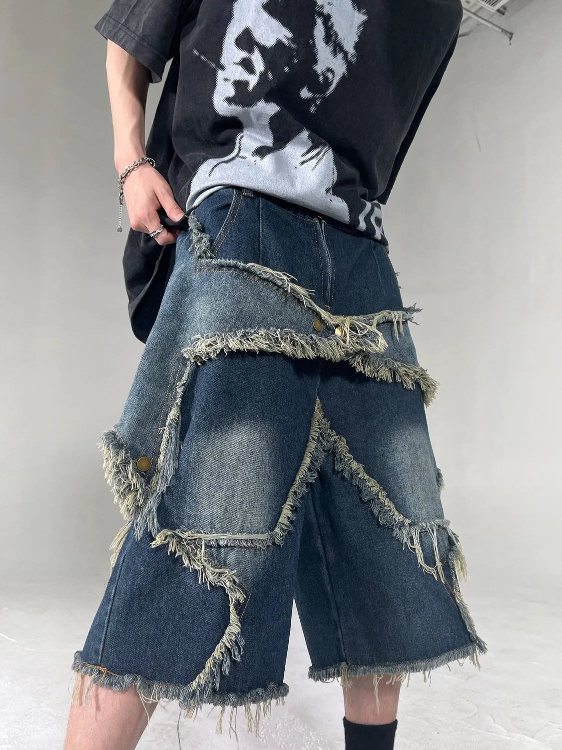 Men's blue retro denim shorts with frayed five-pointed star design and distressed detailing
