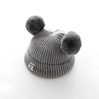 Crocheted baby wool cap in beige with soft 5 cm plush ball, high top style for 6 months-3 years winter warmth, flanged edge for secure fit