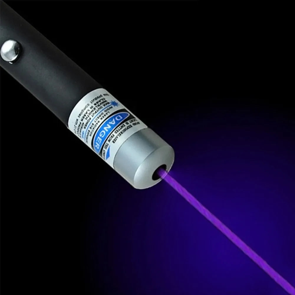 Black 5mW laser pointer pen with copper and aluminium body, red dot beam visible on dark surface