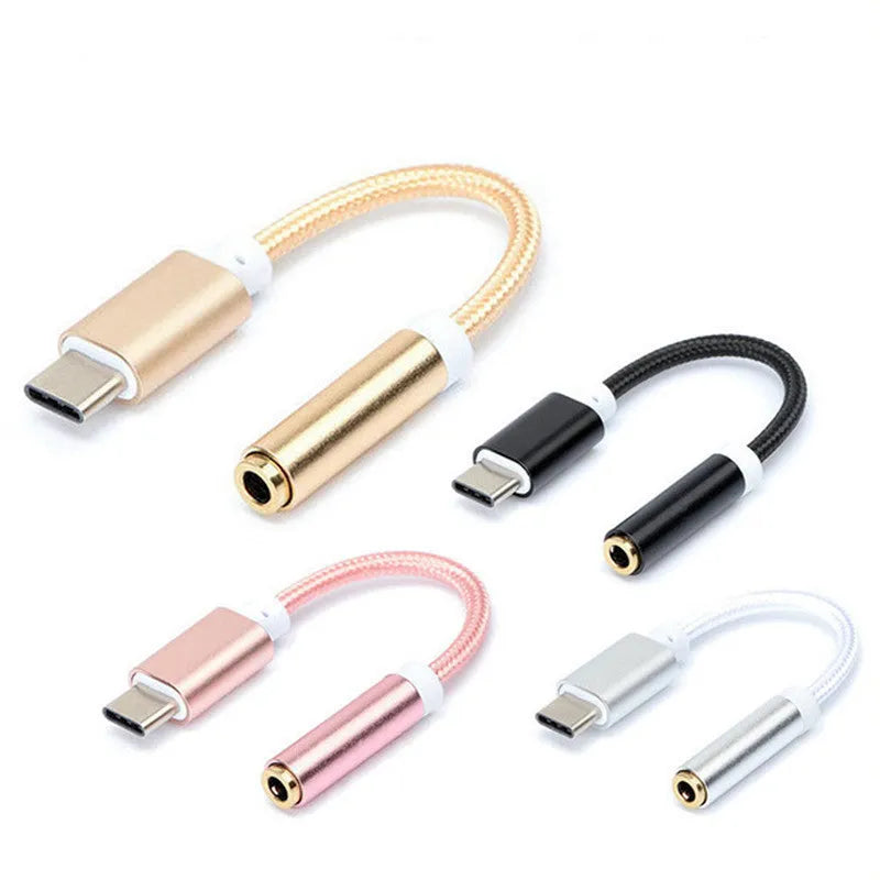 Close-up of a black nylon TYPE-C to 3.5mm female headphone adapter cable on a white background.