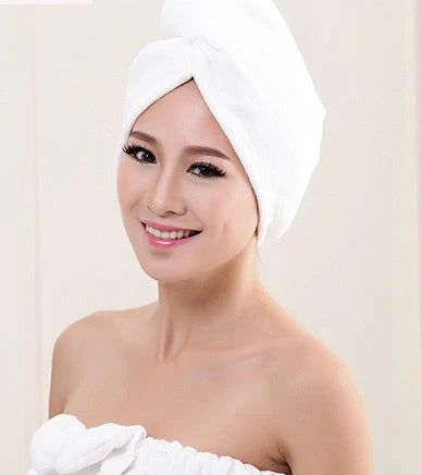 Absorbent microfiber hair turban in various vibrant colours, designed for fast and convenient drying