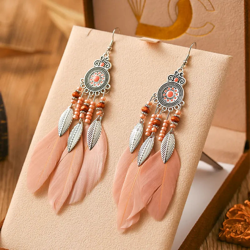 Bohemian feather drop earrings in leaf shape with pattern details, available in multiple electroplated colours.