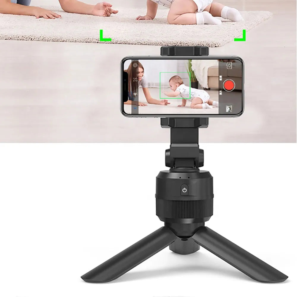 Black 360 degree rotating mobile phone holder on a desk, ABS construction with full rotation capability