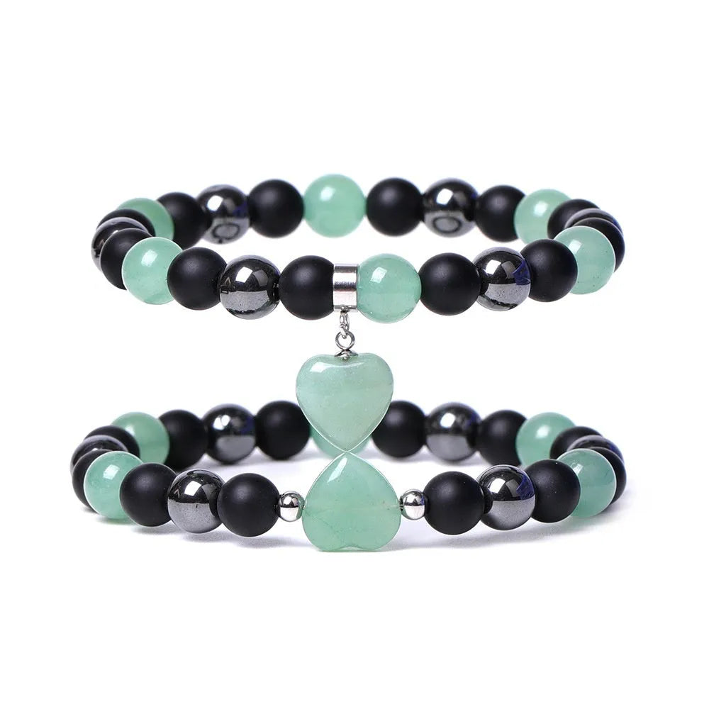 Hand-cut geometric peach heart stone bracelet with moon and planet decorative elements in eight colour options