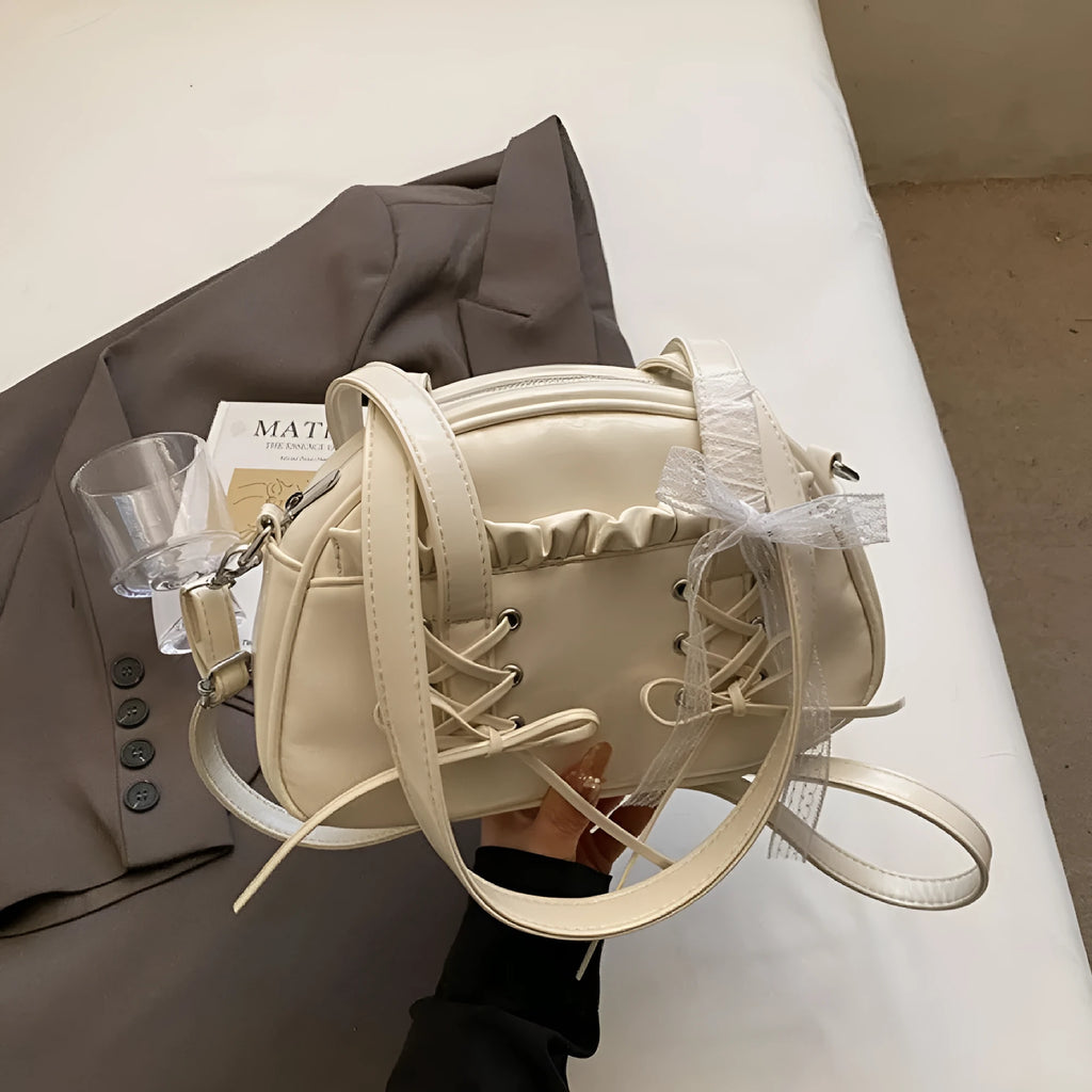 Women's casual PU bandage bow shoulder handbag with visible stitching, shown in milky white colour.