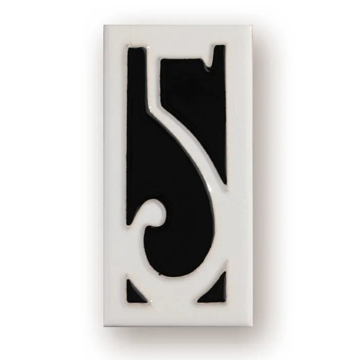 Handmade ceramic retro doorplate with enamel art number on a dark background.