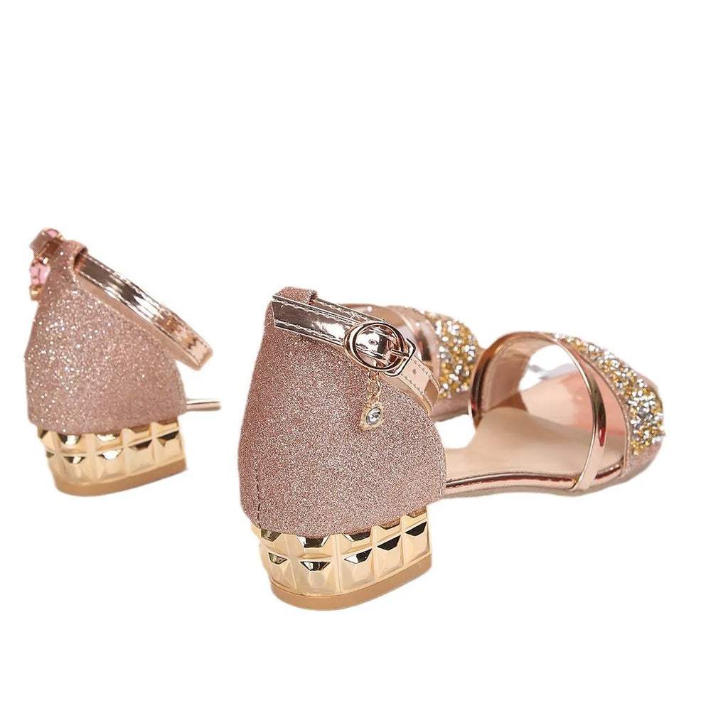 Women's plus size Roman style sandals with exposed toe and rhinestone detail on buckle.