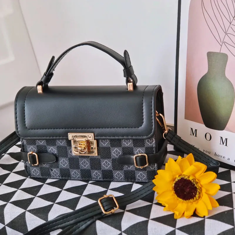 Small square retro patterned crossbody bag in PU leather with a file compartment inside.