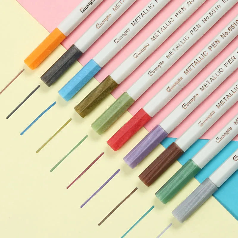Black card album containing a set of coloured triangular-grip metal pens