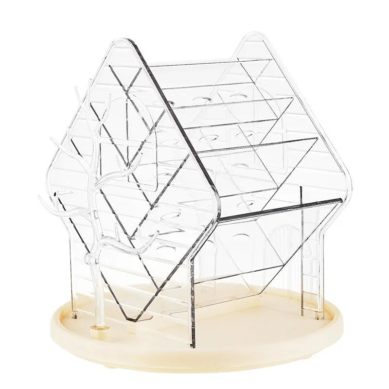 Clear and amber gold rotating plastic cosmetics storage box organiser on a vanity.