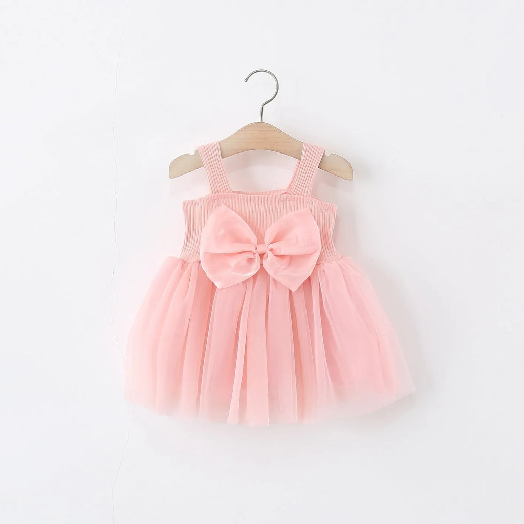 Girls sleeveless solid colour summer dress in polyester fibre, sling style, available in pink and red sizes 80-120