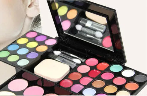 Three-layer makeup box set with 24 eyeshadow colours, 8 lipsticks, blushes, powder cakes, brushes, puff, and mirror
