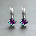A pair of women's copper earrings with a diamond design made from inlaid zircon stones.