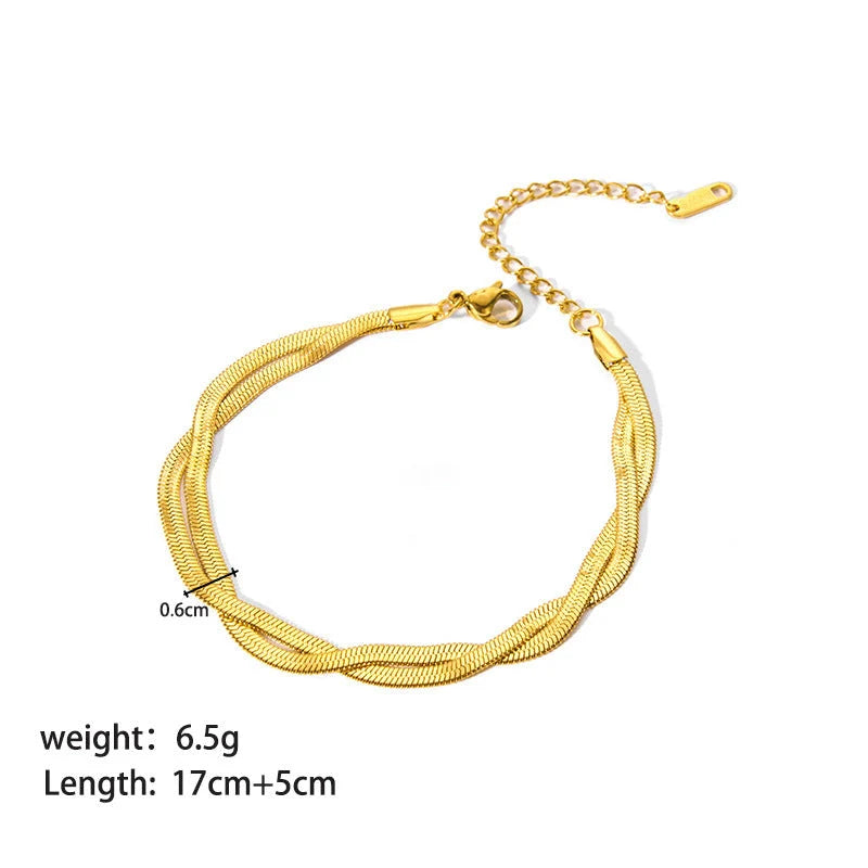 Stainless steel ornament bracelet with real gold treatment in various colours