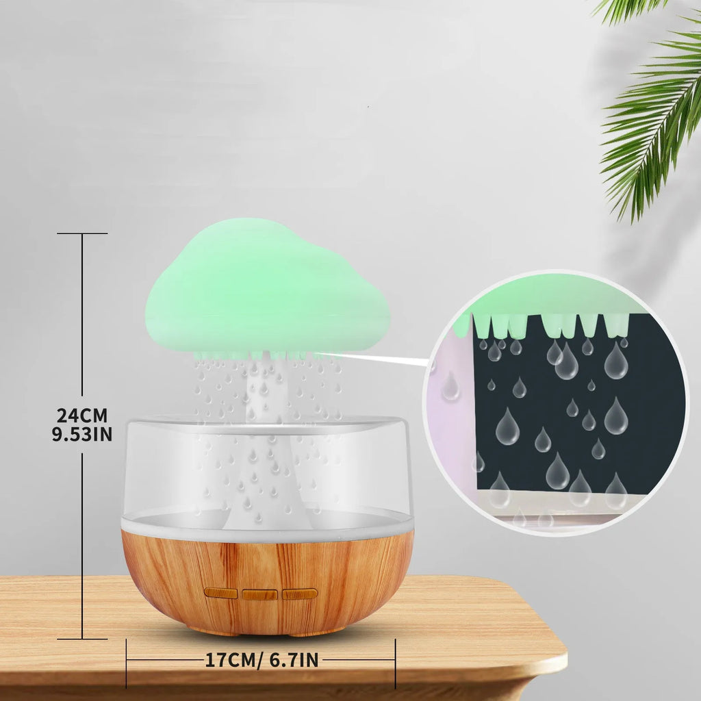 White cloud-shaped humidifier with night light and water drop effect on a table