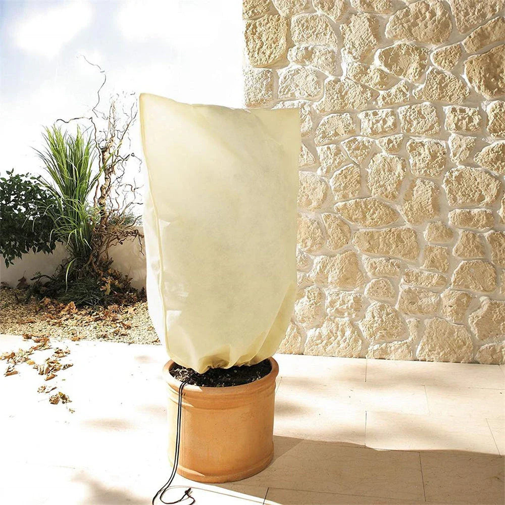 Adjustable plant cover in beige color, designed to protect plants from cold weather and harsh winter conditions