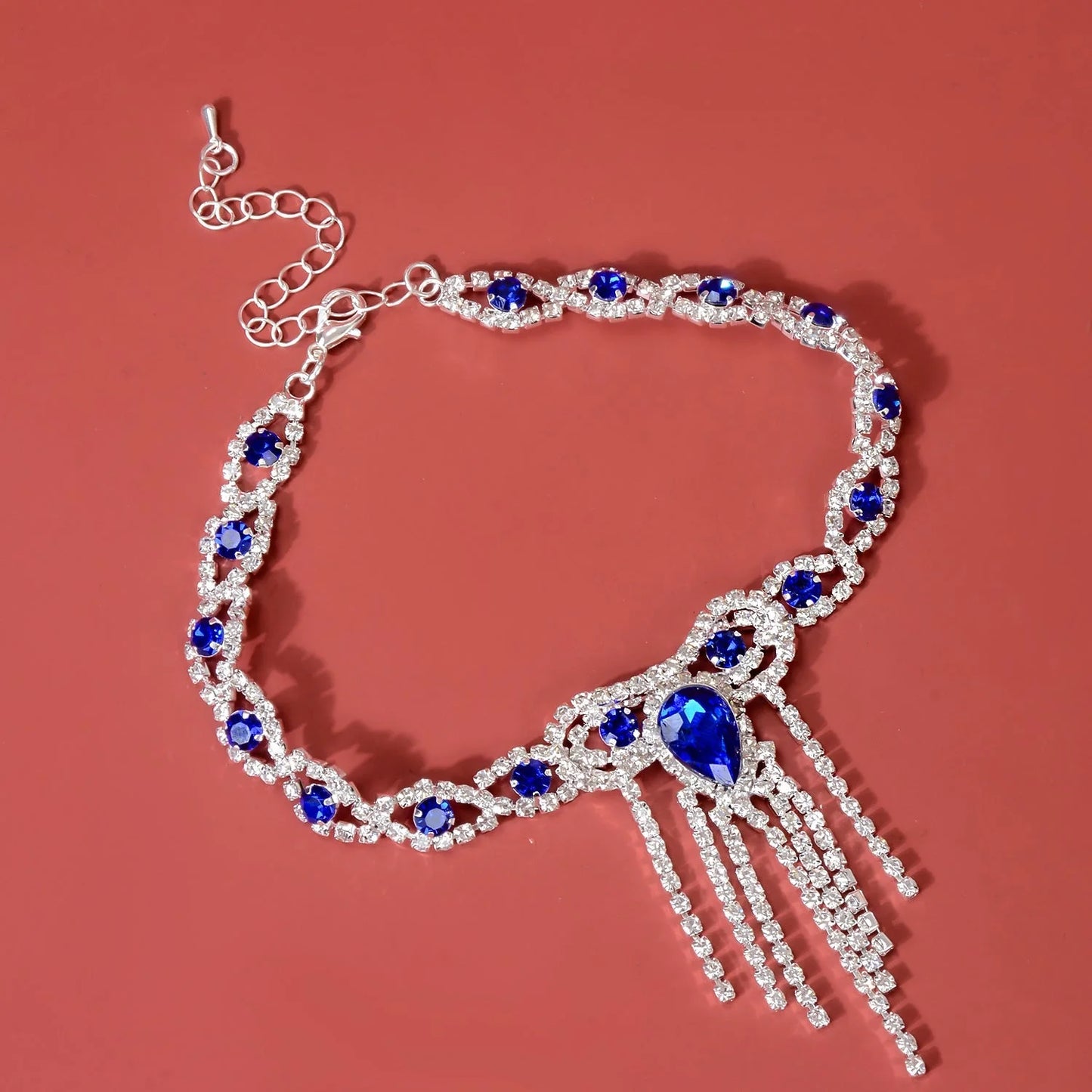 Blue rhinestone tassel anklet with gold-plated accents and semi-precious stones