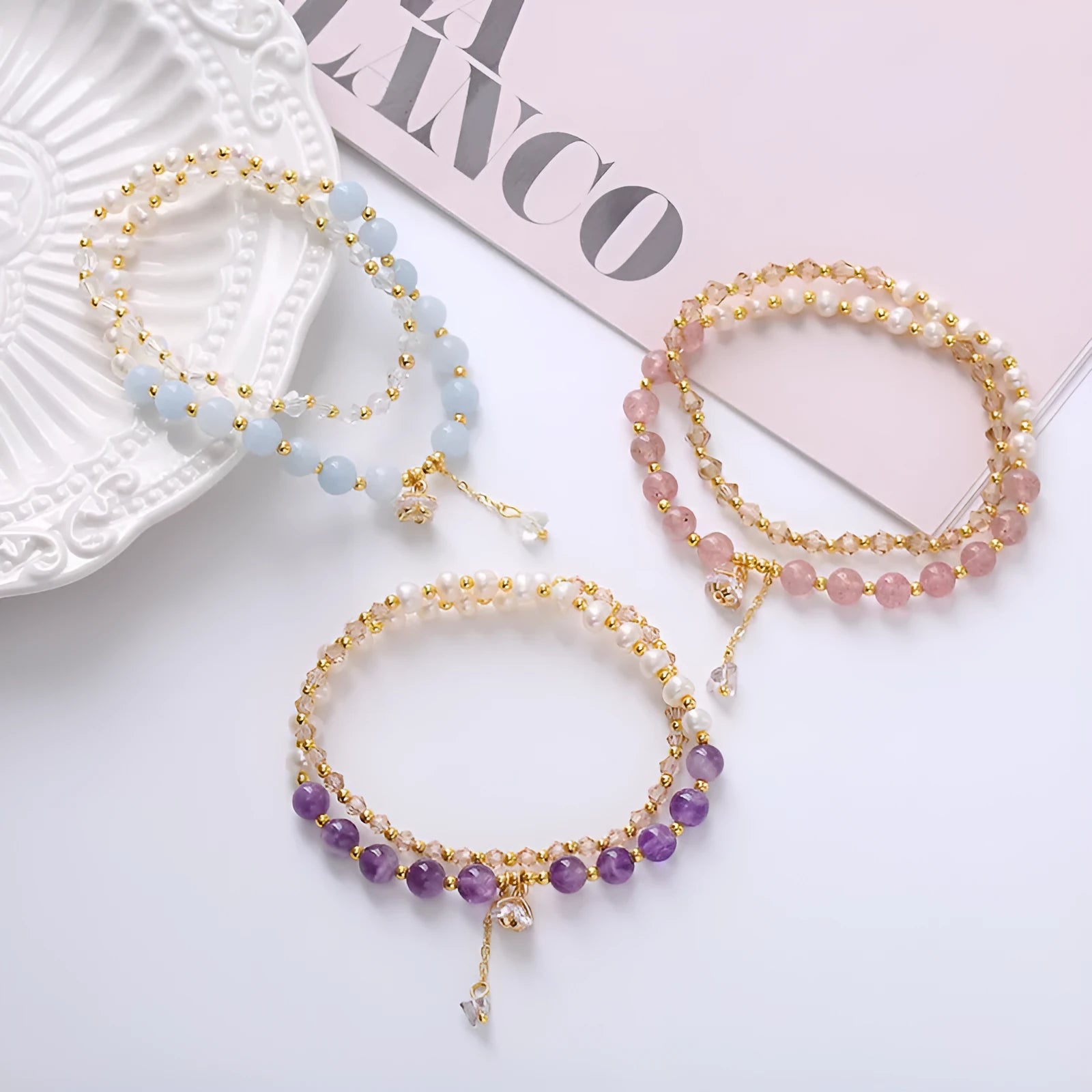 Women's double ring bracelet with crystal charms in choice of strawberry quartz, amethyst, or aquamarine colour.