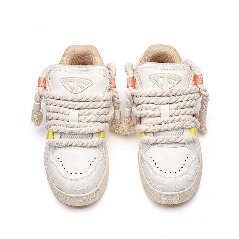Creamy white retro skate shoes with old damage lace detailing and rubber soles