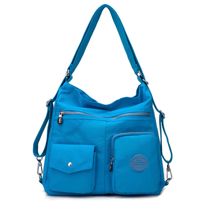 Women's waterproof nylon crossbody bag with organizational pockets and 34cm laptop capacity
