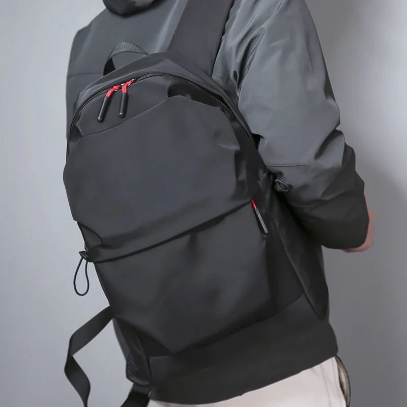 Durable nylon backpack in black and light grey with adjustable straps