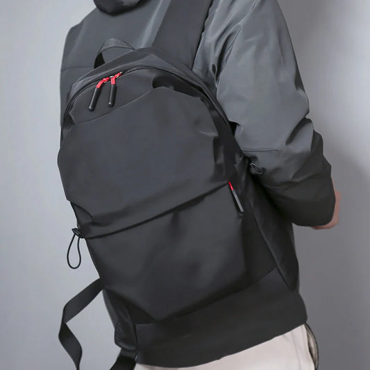 Durable nylon backpack in black and light grey with adjustable straps