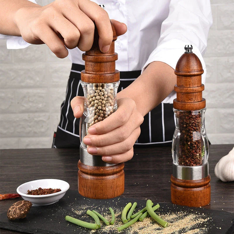 Wooden Salt and Pepper Grinder Set with adjustable coarseness on kitchen table