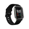 Black waterproof smart bracelet with 1.4-inch screen and silicone strap on a wrist