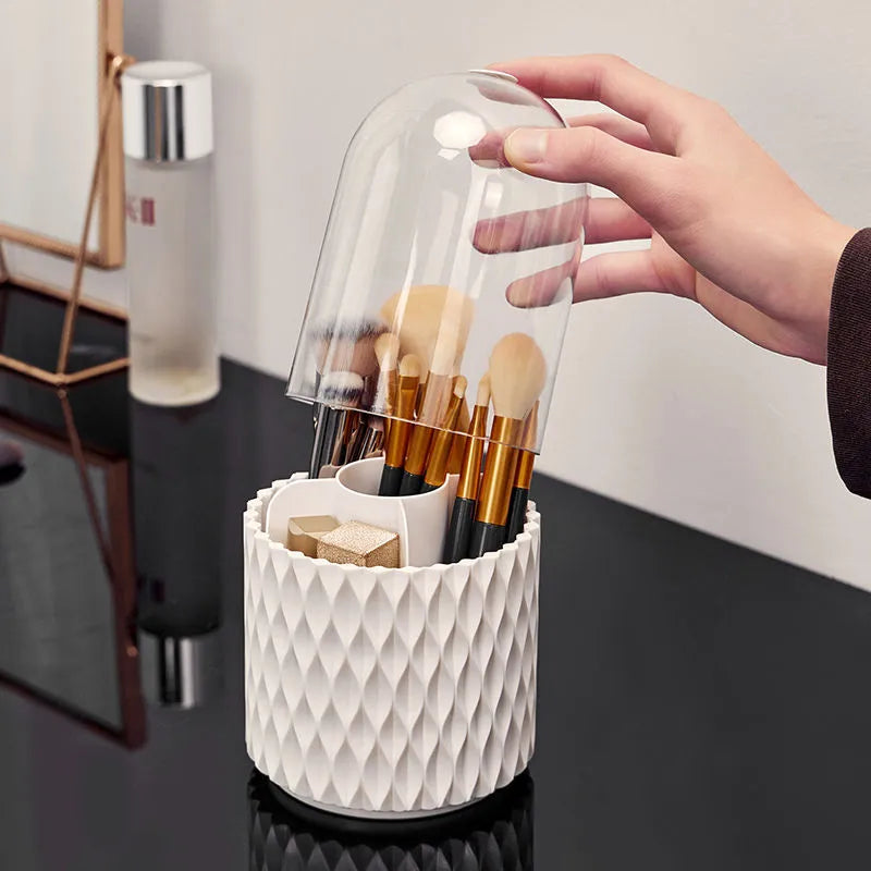 White rotating acrylic makeup brush holder with transparent dust cover showing brush compartments