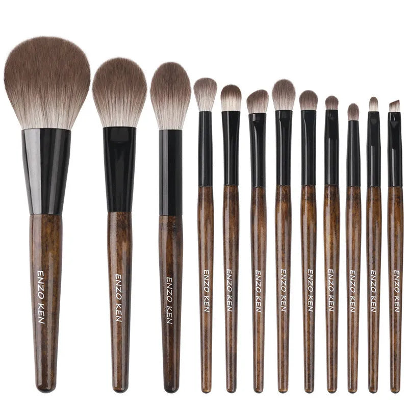12-piece wooden handle makeup brush set with a powder brush in a grey PU pouch