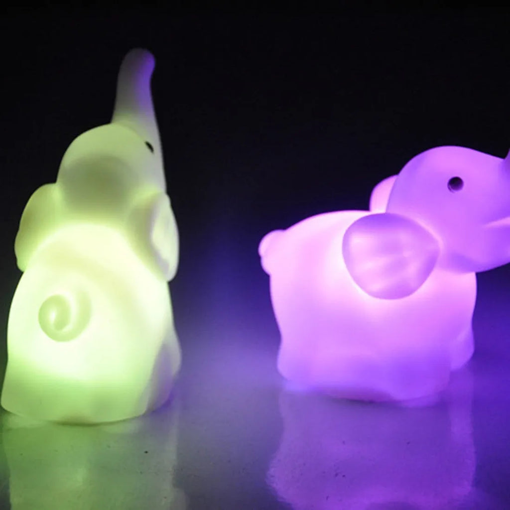Elephant night light with 7 colour changing slow flashing modes, vinyl body, size 8x8.8x4.5cm, battery powered