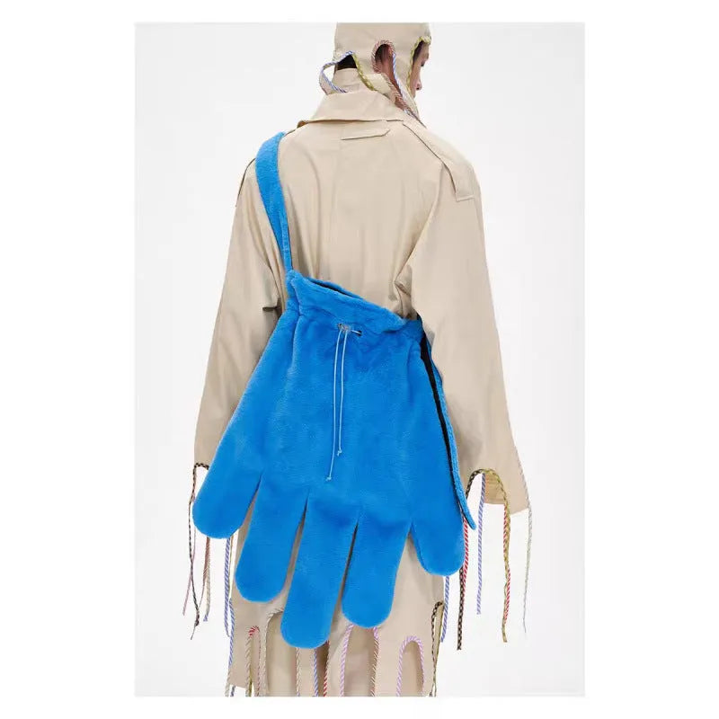Blue fur 14-inch crossbody bag with velvet lining and sewing thread details, shown on a model for scale