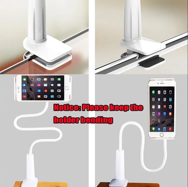 Black oversize flat panel phone stand with a long adjustable arm on a wooden table.