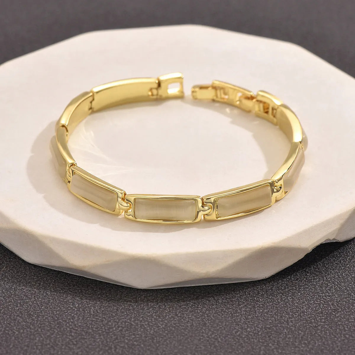 Geometric rose gold opal bracelet for women with quadrilateral alloy frame and gemstone inlay