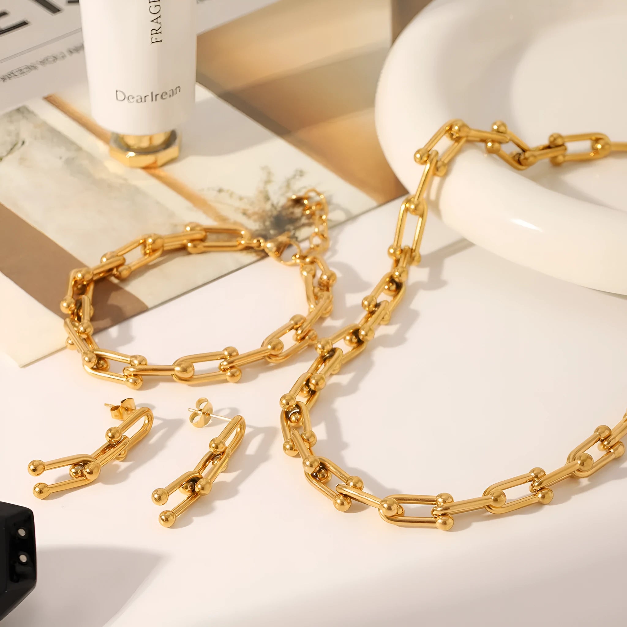 Stainless steel horseshoe chain jewellery set with titanium steel pendant showing necklace, bracelet and earring pieces